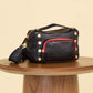 Evan Crossbody | Cargo Black/Brushed Gold Red Zip | Sml