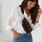 Charles-Crossbody-Black-BG-R-Zip-Lifestyle-View-On-Model-Crossbody