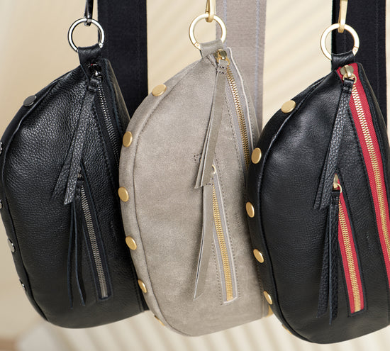 Image of Three Charles meds haning, Colors featured from left to right is Black gunmetal, Pewter brushed gold, Black brushed gold red zip.