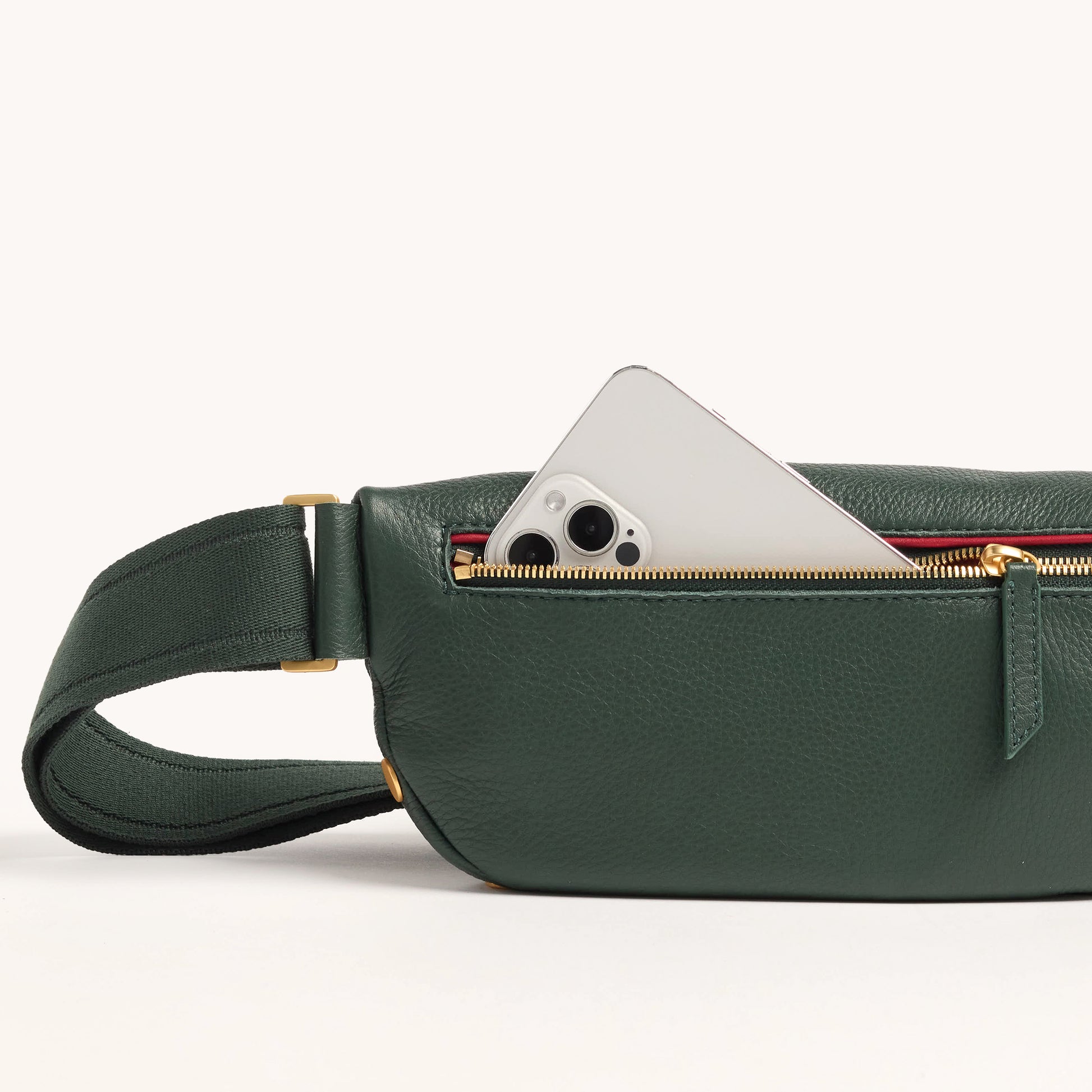 Charles-Crossbody-Med-Green-Room-Pebble-BG-Front-View-Detail